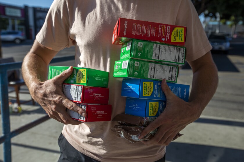 Josh Goldstein bought 10 boxes of Girls Scout cookies for himself and some for his friends.