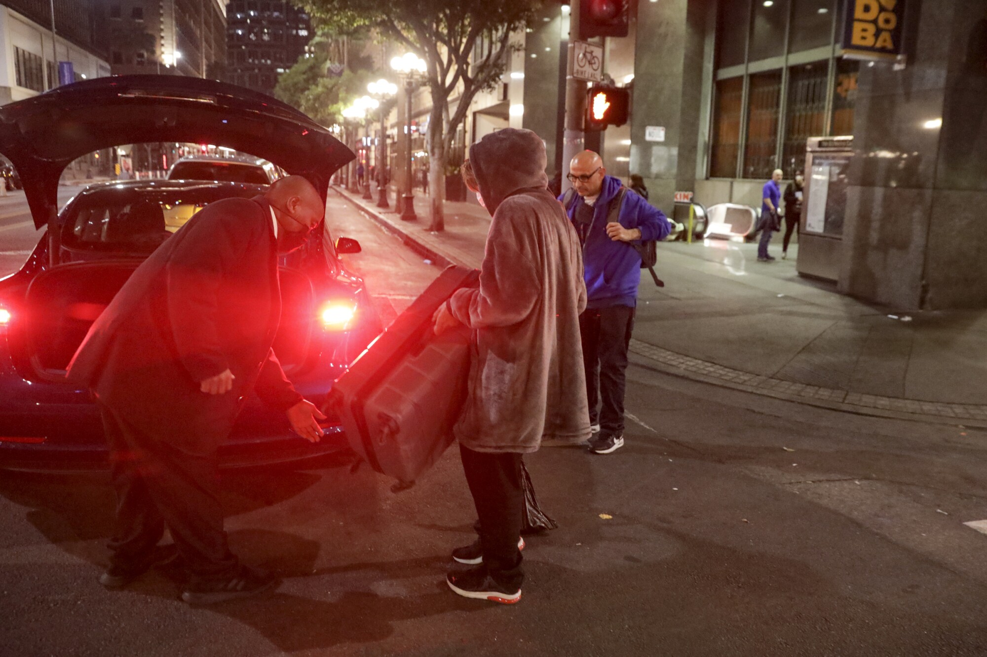 A homeless person leaves for a shelter by Uber, arranged by People Assisting the Homeless 