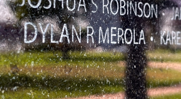 Marine Corps Lance Cpl. Dylan Merola’s name on the Memorial...
