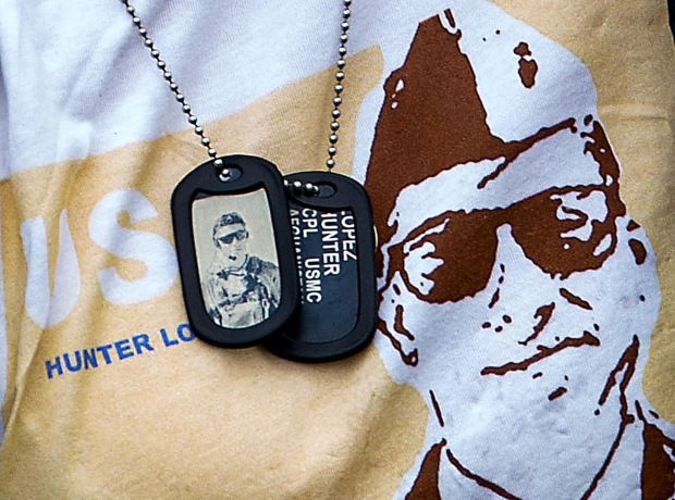 Alicia Lopez wears dog tags with her son’s photo, name...