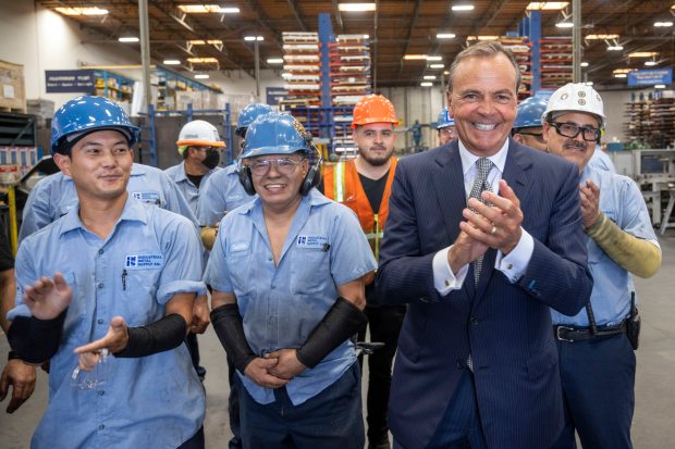 Los Angeles mayoral candidate Rick Caruso talks with workers at...