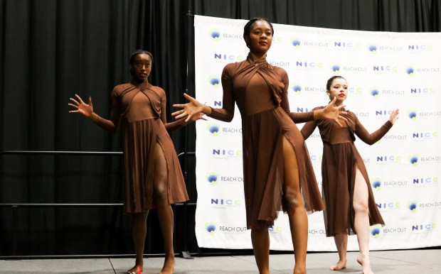 From left, Kasey Knapper, Anita Bausley and Chelsi Hopkins perform at the 2022 National Innovative Communities, sponsored by Reach Out in downtown Riverside. Conference (Courtesy of Reach Out)