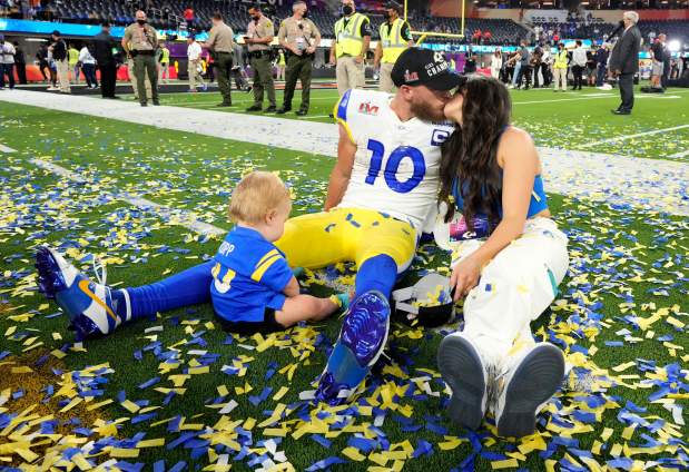 Cooper Kupp of the Los Angeles Rams celebrates with his wife, Anna Croskrey, with a kiss on the field after the Rams defeat the Cincinnati Bengals 23-20 in an NFL Super Bowl LVI football game at SoFi Stadium in Inglewood, on Sunday, February 13, 2022. (Photo by Keith Birmingham, Pasadena Star-News/ SCNG)