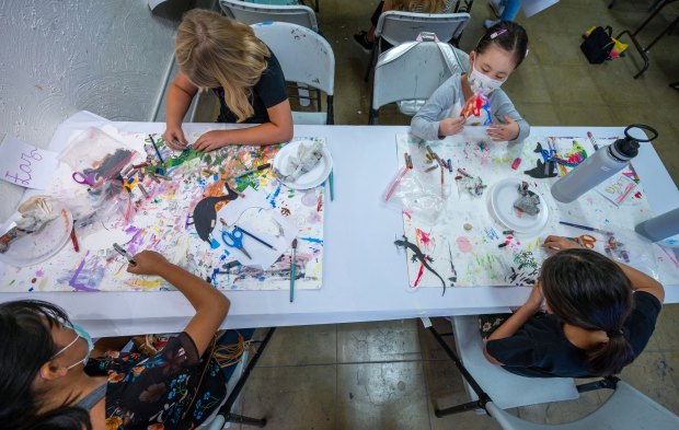 Art students enjoy a Riverside Art Museum summer class Thursday,...