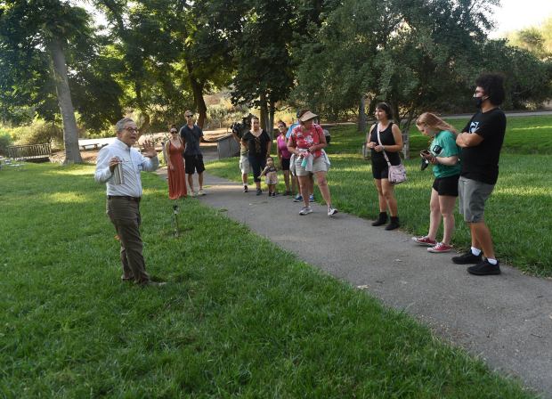 Docent George Spiliotis leads guests during a Saturday, July 16,...