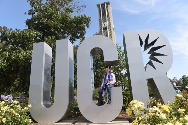 Matthew Kusto poses for a photo on Friday, June 10, 2022, before UC Riverside's School of Business graduation ceremony. (Photo by Milka Soko, Contributing Photographer)