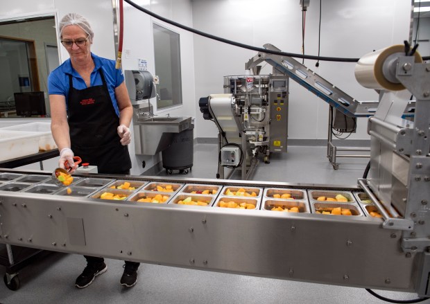 Ocean View School District food service worker, Cary Bourdeau-Rubio, works Central Kitchen, a new 13,000 square foot kitchen in Huntington Beach, CA on Tuesday, December 17, 2019. (Photo by Mindy Schauer, Orange County Register/SCNG)