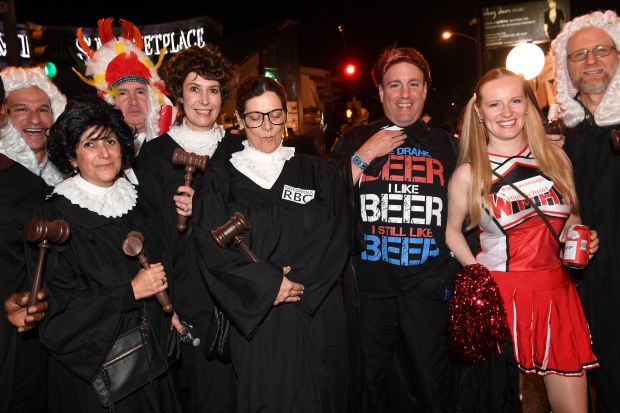 Party-goers show off their costumes at the annual West Hollywood...