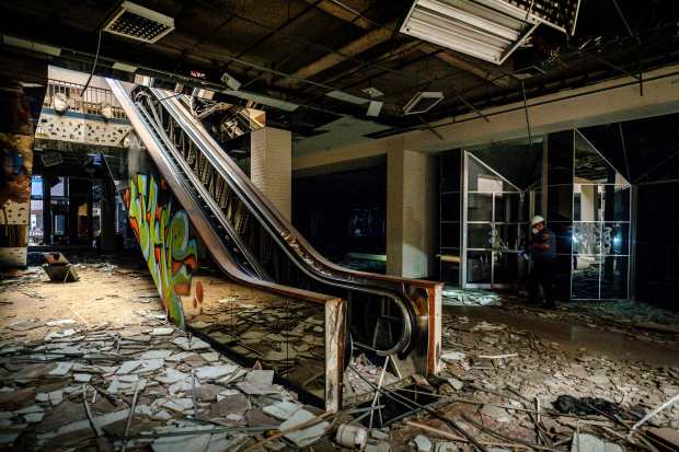 Security patrol for squatters inside the abandoned Carousel Mall in...