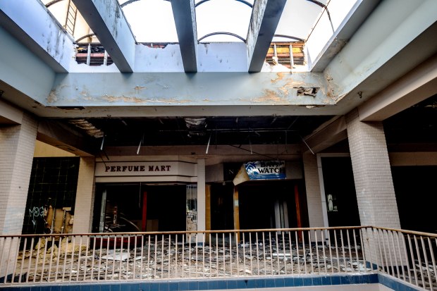 Debris and damaged stores sit inside the abandoned Carousel Mall...