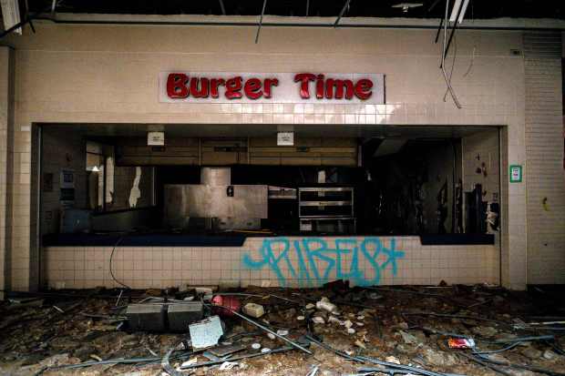 A damaged Burger Time restaurant sits in the abandoned Carousel...
