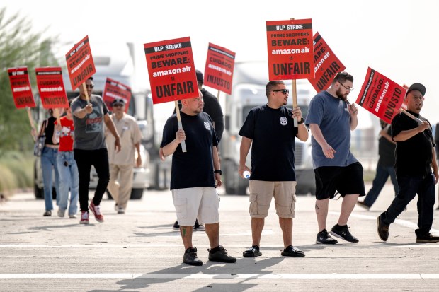 Amazon workers rally in front of their facility, KSBD, a...