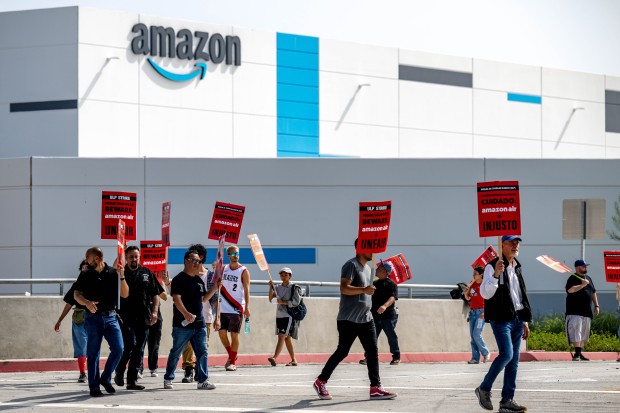 Amazon workers rally in front of their facility KSBD, a...
