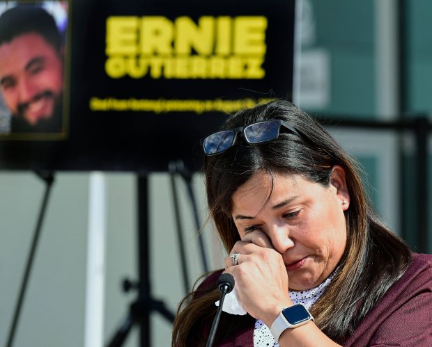 Christina Rodriguez wipes away tears remembering her son Ernie Gutierrez,...